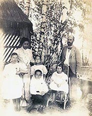 Victor and Nadia Stember with four of their children, photographed outdoors among birch trees