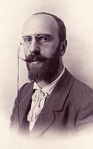 Victor Stember as a young man wearing pince-nez on a cord and a loose cravat