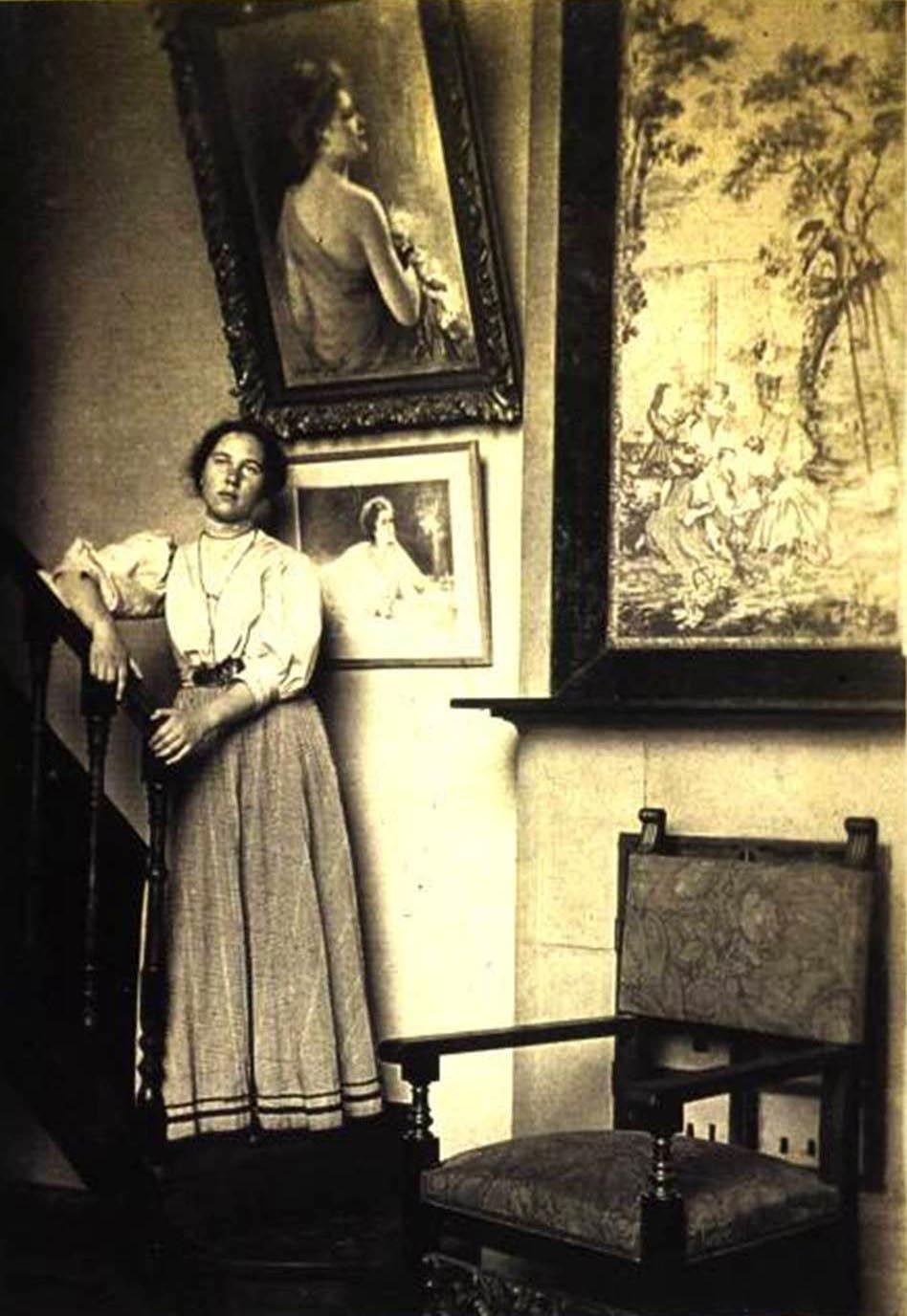 This family photo shows the artists daughter Natalia standing by this lovely portrait in 1909 in St.